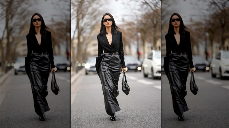 Woman with maxi leather skirt and black jacket