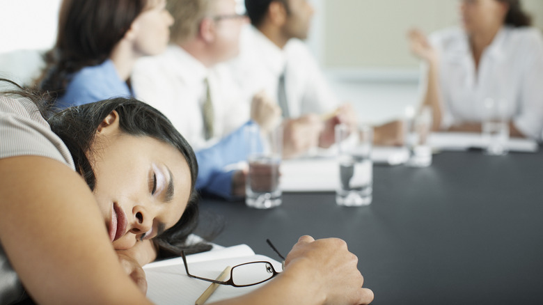 Woman sleeping in a meeting 