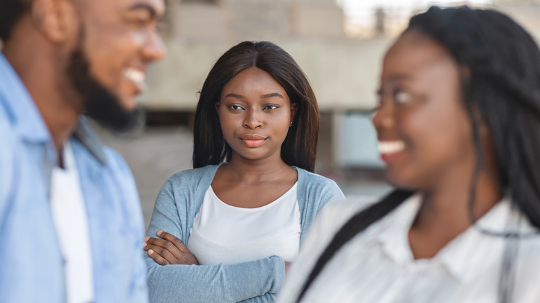 woman angry at flirting boyfriend