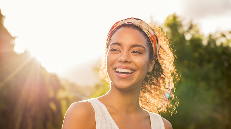 Woman smiling in the sun