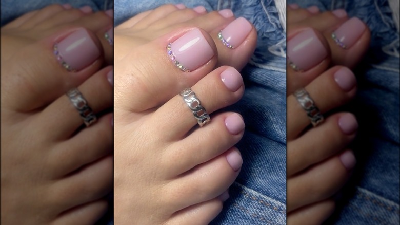 Pastel pink jewel pedicure nails