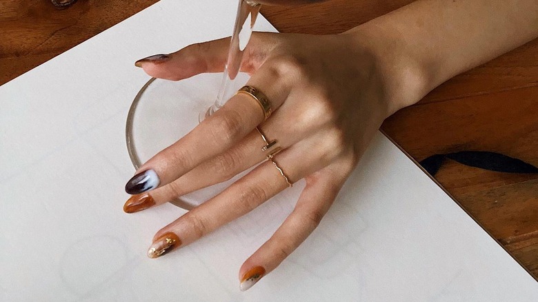 iced coffee nails holding drink