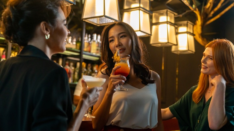 women drinking at a bar