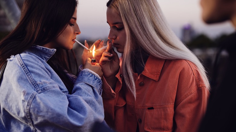 Two women smoking cigarettes