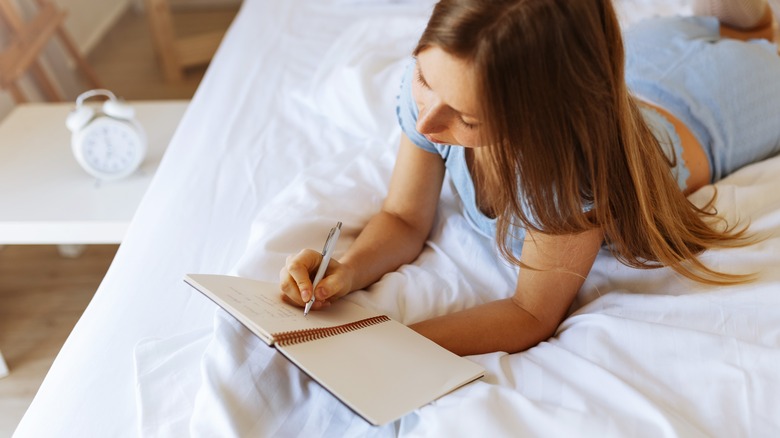 Woman writing a gratitude list