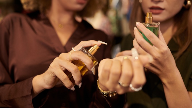 women sampling perfume