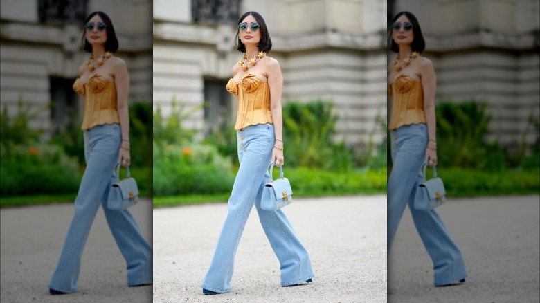 Woman wearing flared light-wash jeans