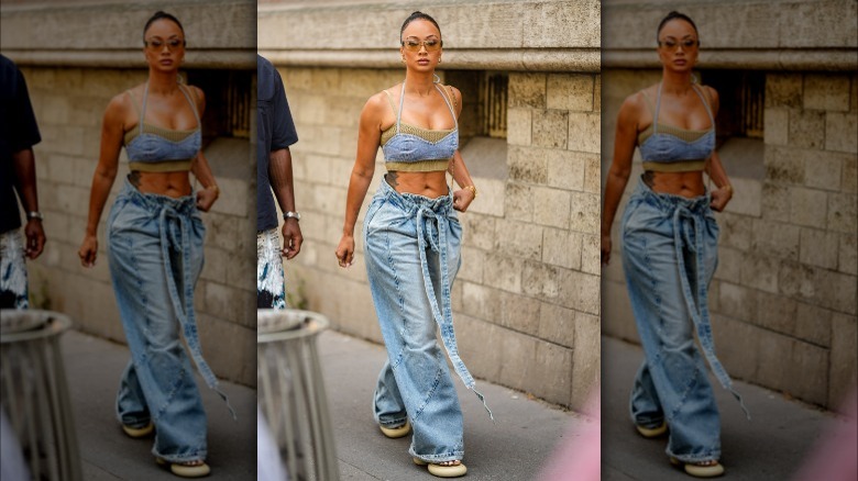 Woman wearing baggy light-wash jeans