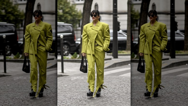 woman wearing lime green jacket and pants