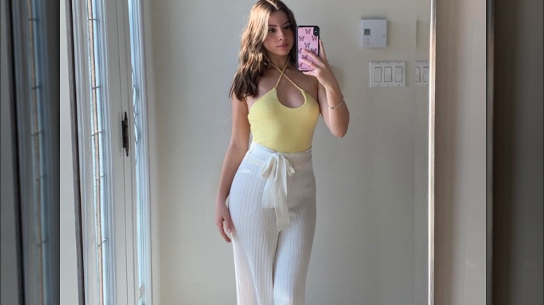 Yellow top and white pants