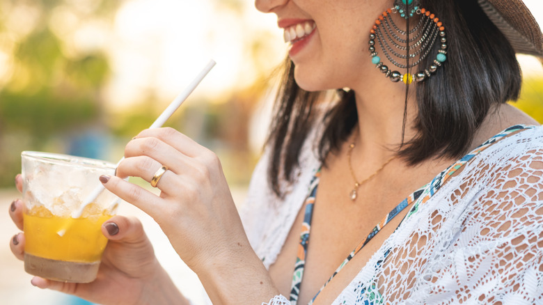 Woman drinking cocktail