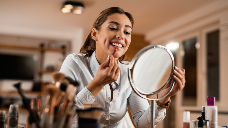 Woman applying lip liner