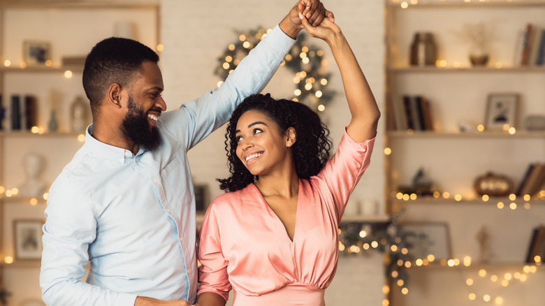 Couple dancing at home