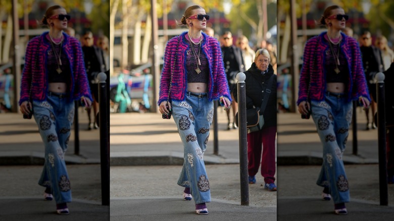 woman wearing jeans with patches