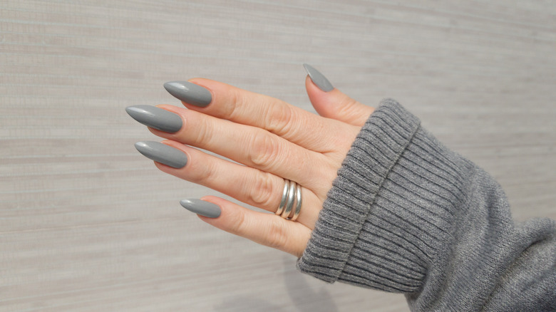 Hand with mid-tone gray manicure 