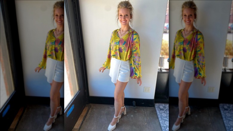 woman wearing floral blouse and skort