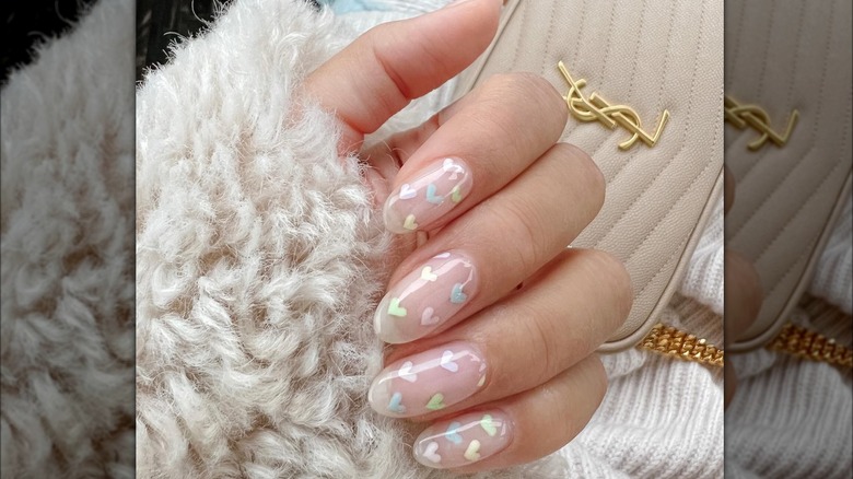 Clear manicure with pastel hearts