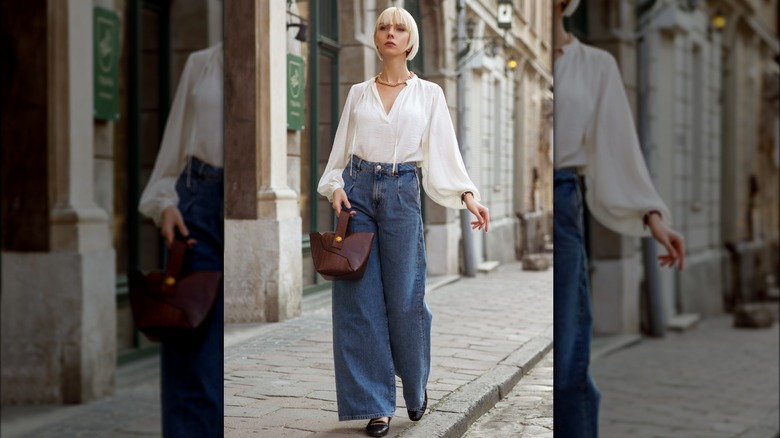 white top with denim trousers