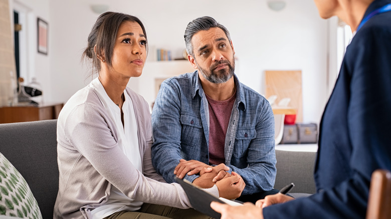 man and woman with therapist