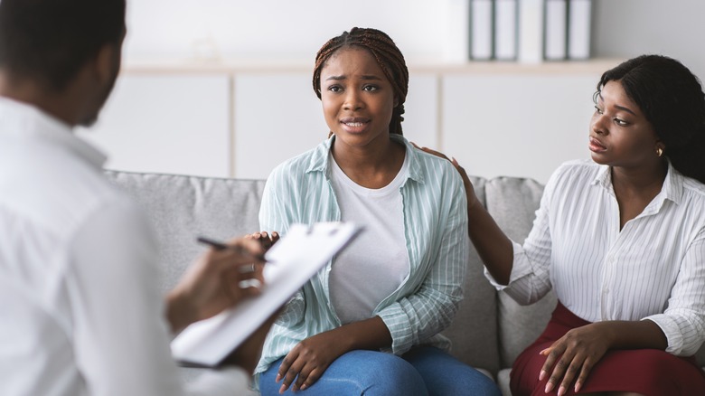 two women with therapist