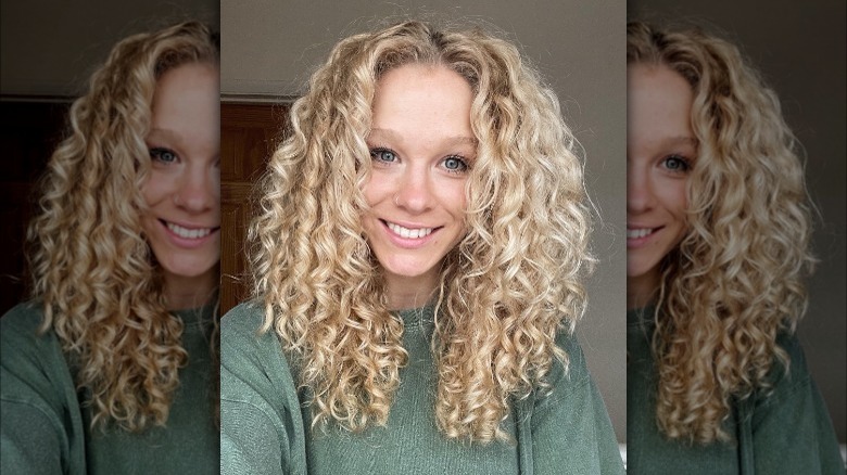 Girl with blond curly layers.