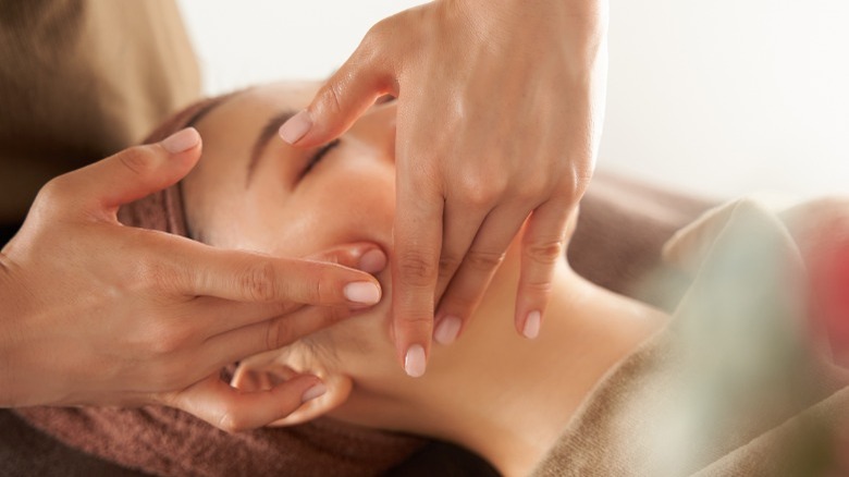 Woman getting a facial massage