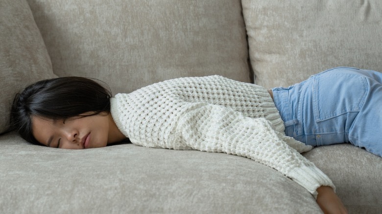 Woman sleeping on couch