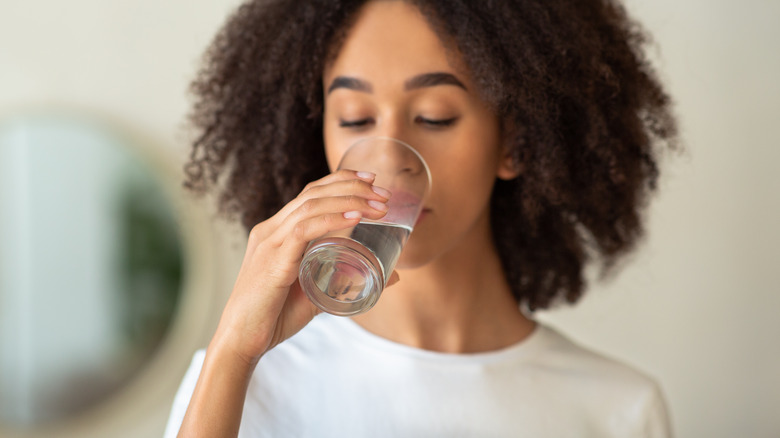 Black woman drinking water