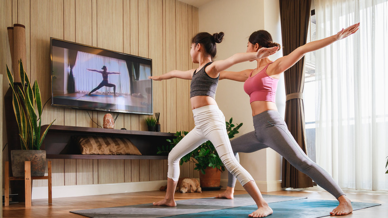 Mother and daughter practicing yoga