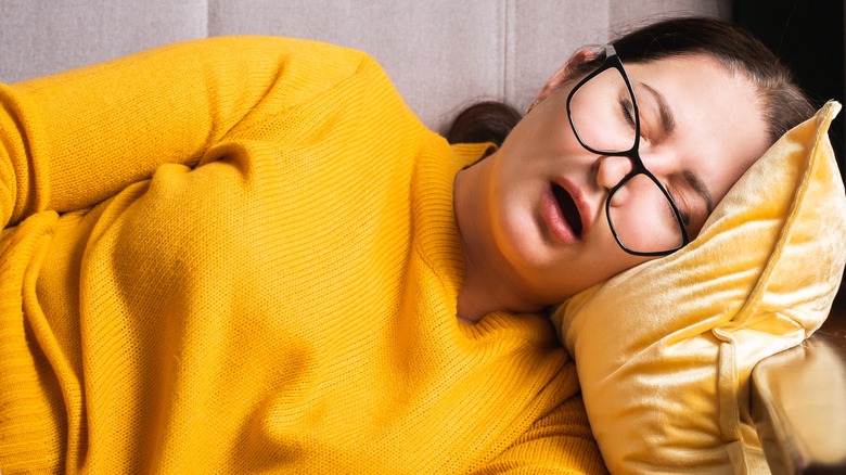 woman napping on a couch