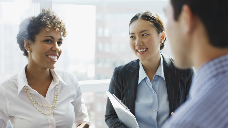 happy coworkers chatting 