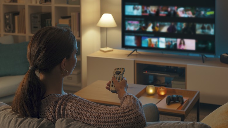 woman on couch watching tv