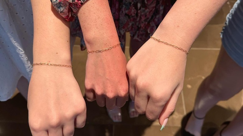 wrists with permanent friendship bracelets