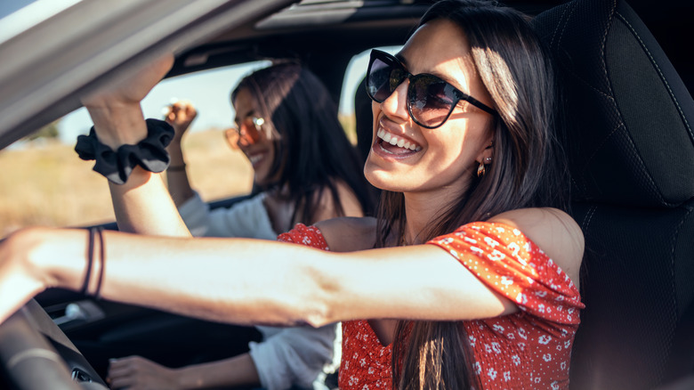 friends singing in car