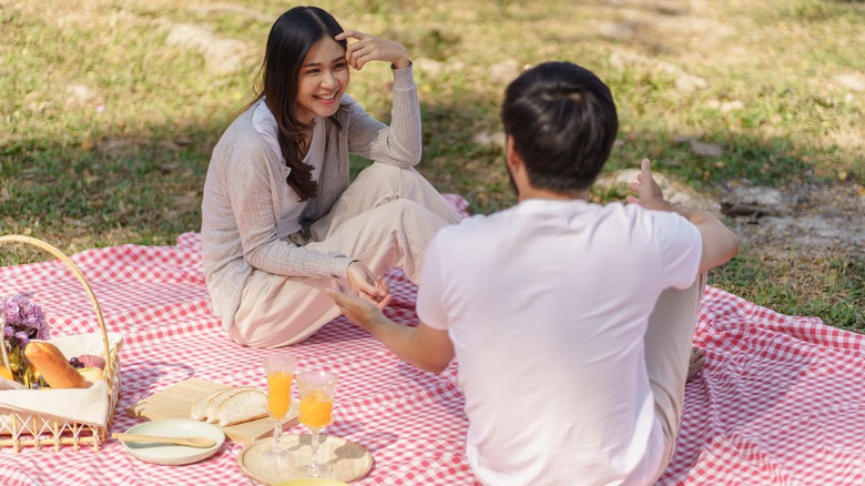 couple eating picnic outside