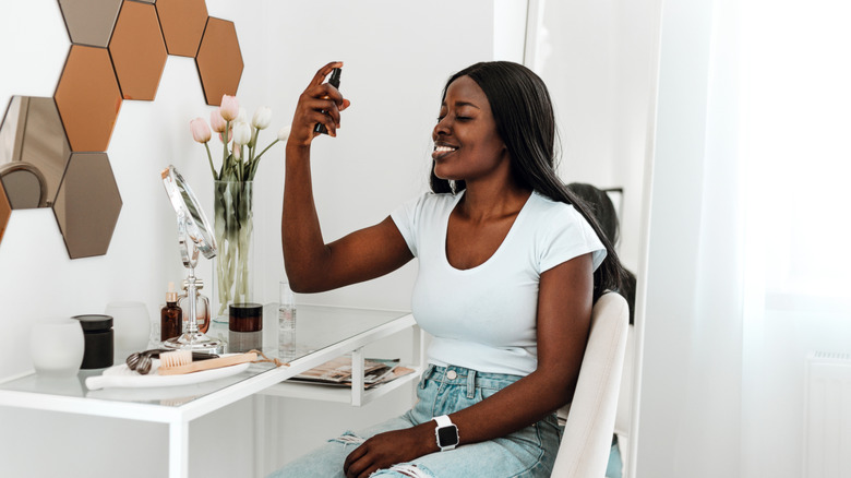 Woman using a facial spray