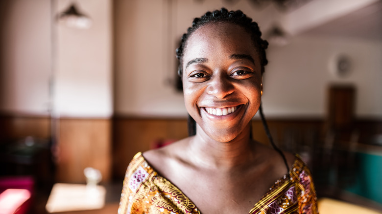 A woman smiling at the camera