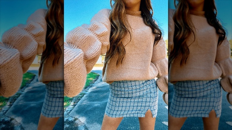 Pink sweater and blue skirt