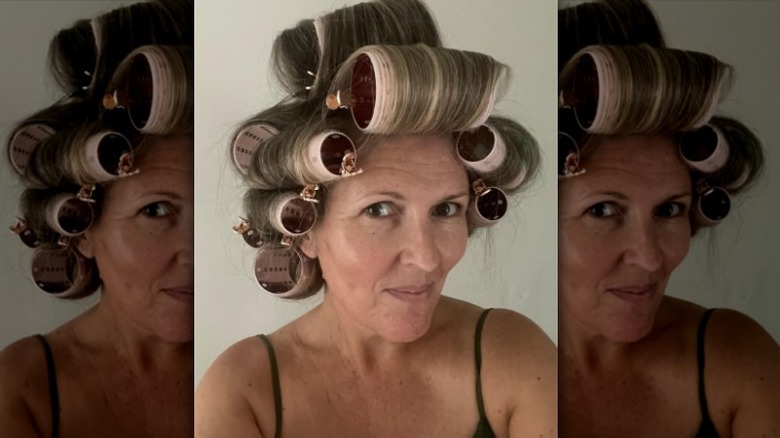 Woman with rollers in hair