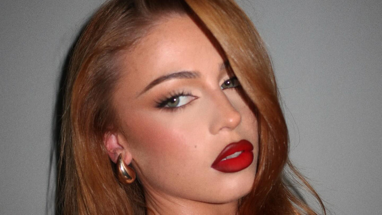 Red lipstick gold earrings