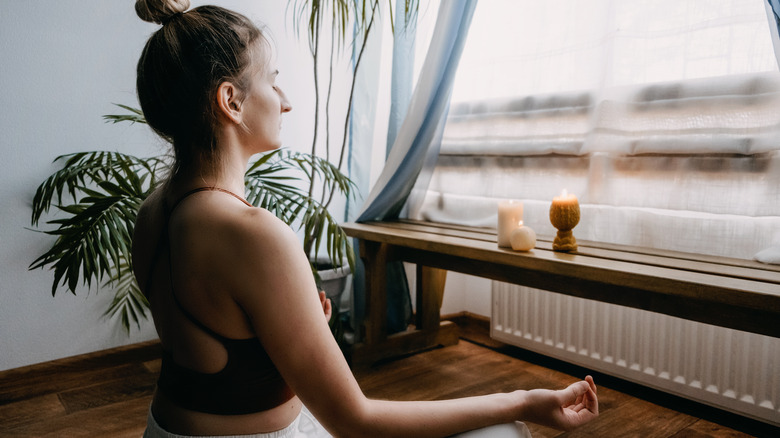 young blonde woman meditating and relaxing