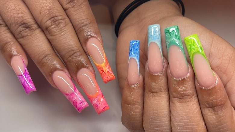 Instagram user @nailsbyjjazz showing multi-colored french manicure