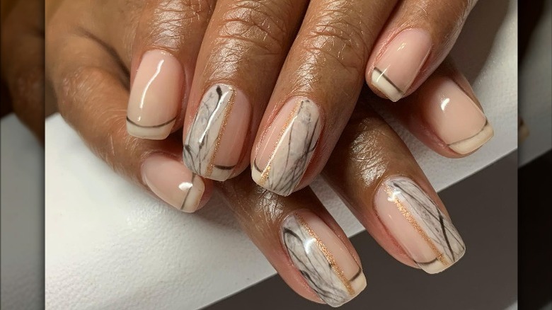 Instagram user @1nailguru showing marbled french manicure