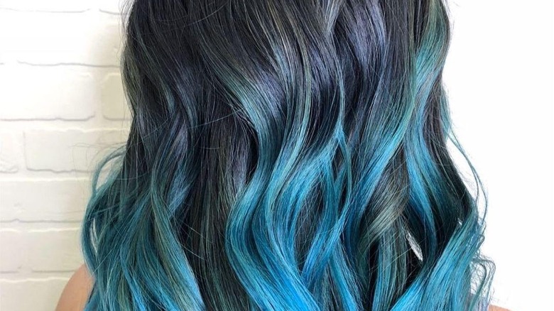 person with blue and black marbled hair