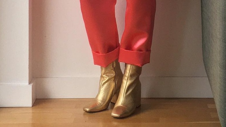 woman wearing satin boots