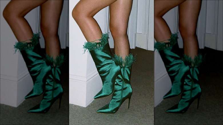 woman wearing satin boots