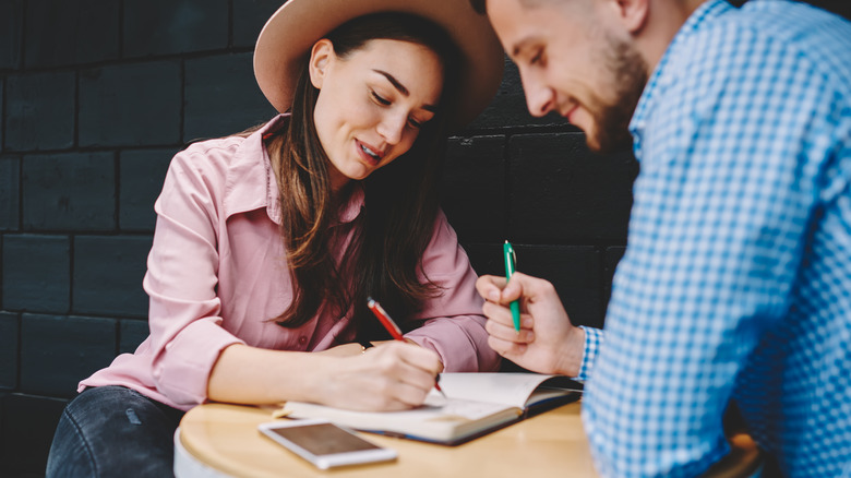 A couple making a checklist 