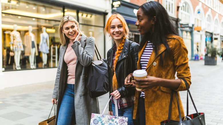 Three young women walking in London 