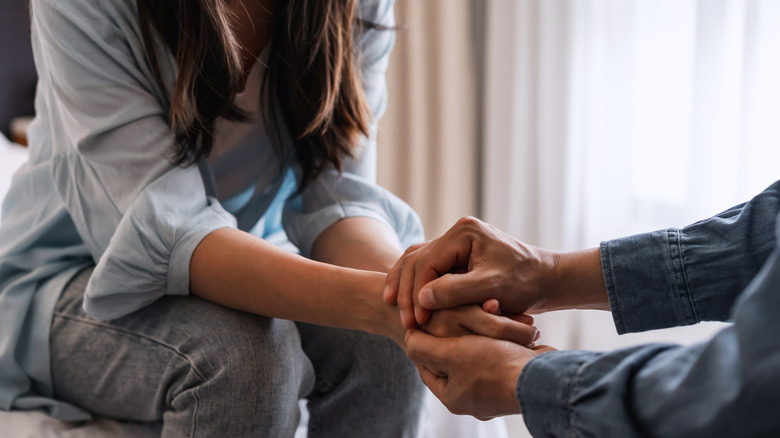 couple holding hands