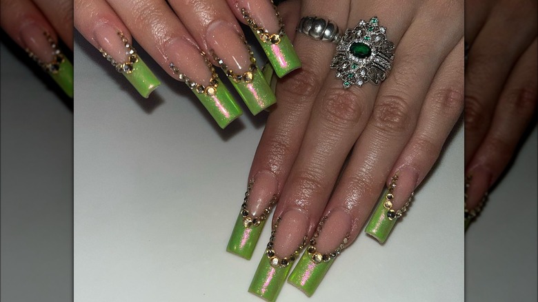 Green nails with gold accents